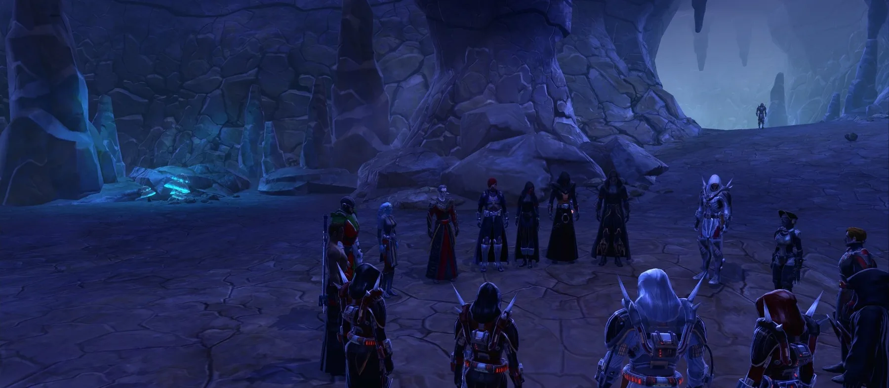 A circle of roleplayers gathered in a cave, in game